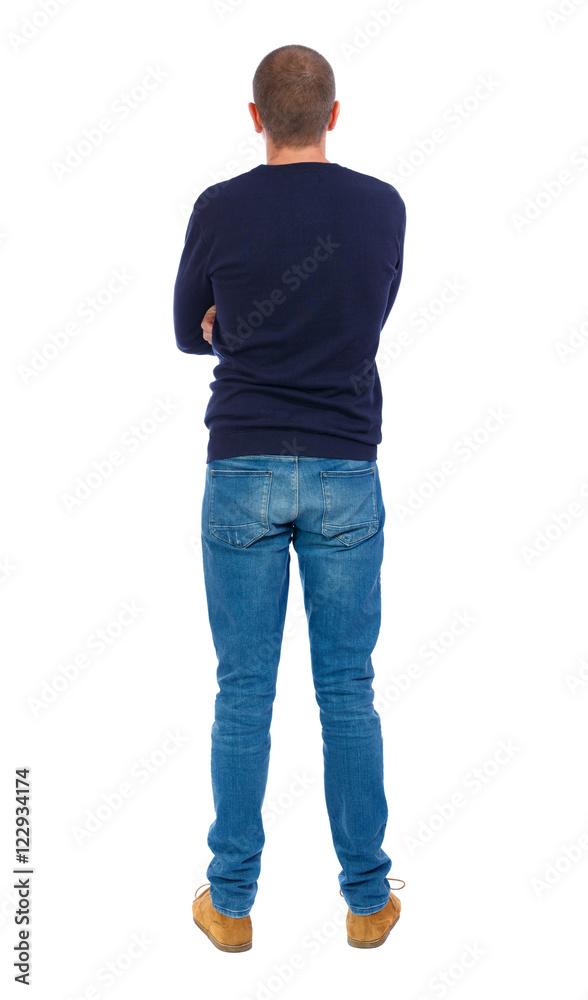 Back view of man in jeans. Standing young guy. Rear view people collection. backside view of person. Isolated over white background. Man in warm jacket standing arms folded. Back view of man in jeans. Standing young guy. Rear view people collection. backside view of person. Isolated over white background. Man in warm jacket standing arms folded.