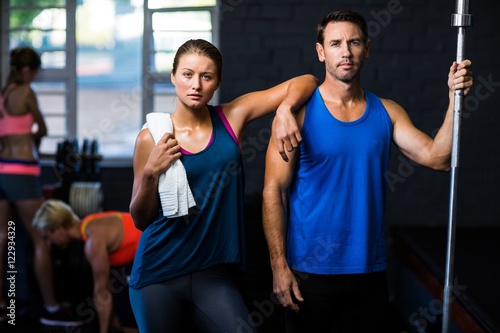 Portrait of fit serious friends in gym