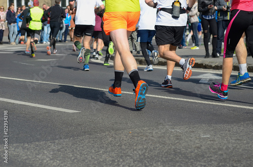 Marathon running race, runners feet on road, sport, fitness and healthy lifestyle concept 