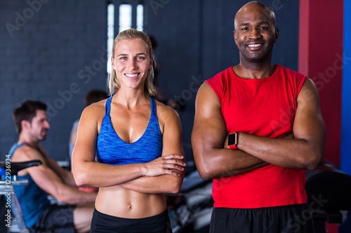 Portrait of smiling friends with arms crossed in gym © WavebreakMediaMicro