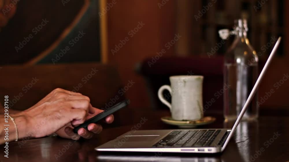 Man working on a laptop in a cafe
Man working on a laptop in a cafe