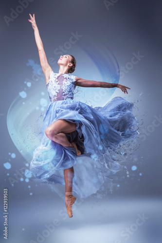 The beautiful ballerina dancing in blue long dress 