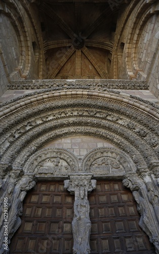 Portada occidental de La basílica de los Santos Hermanos Mártires, Vicente, Sabina y Cristeta,  San Vicente,  templo románico de Ávila, España photo