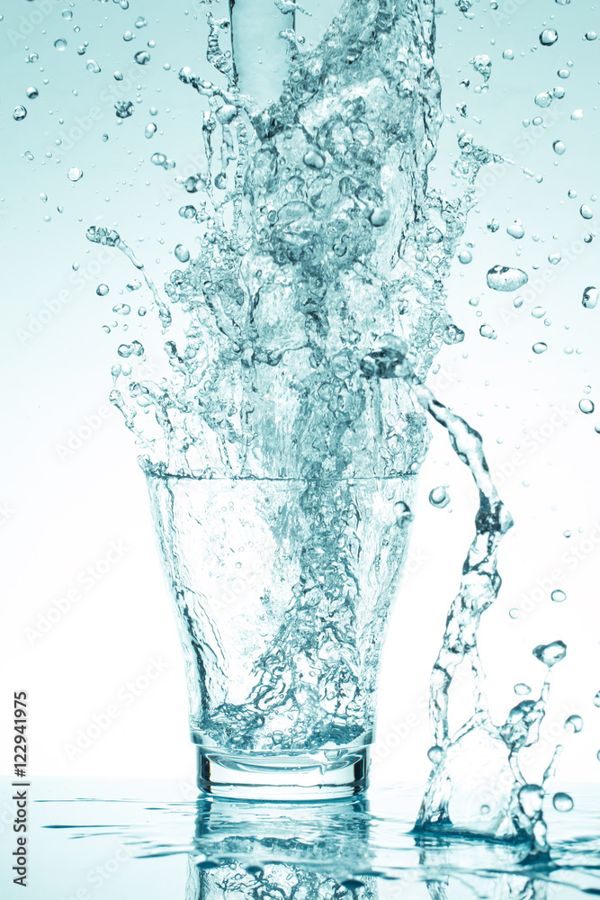 water splash in glasses isolated on white water splash in glasses isolated on white