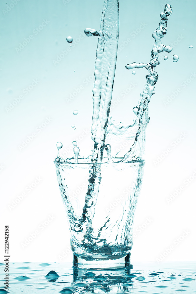 water splash in glasses isolated on white water splash in glasses isolated on white
