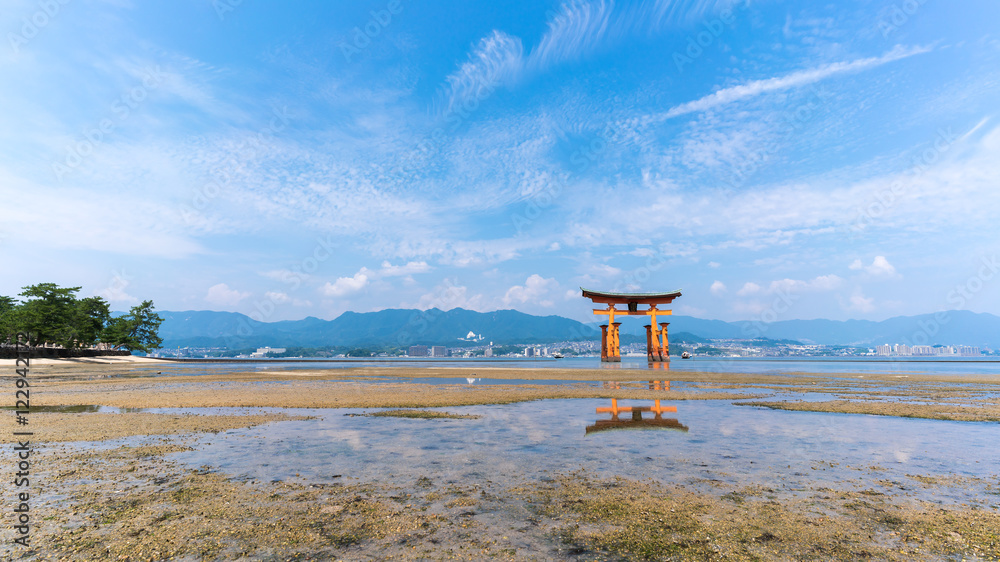The famous orange floating Japanese shinto gate (Torii) of Itsukushima shrine with reflection , Miyajima island of Hiroshima prefecture, Japan The famous orange floating Japanese shinto gate (Torii) of Itsukushima shrine with reflection , Miyajima island of Hiroshima prefecture, Japan