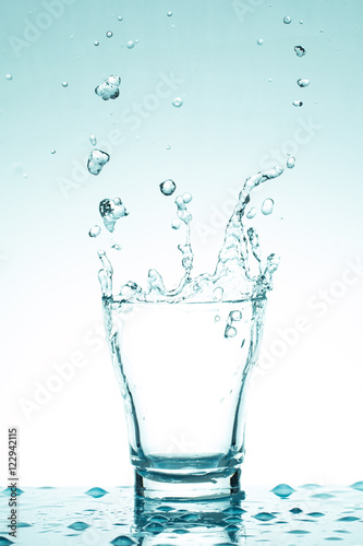 water splash in glasses isolated on white