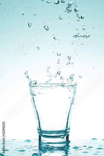 water splash in glasses isolated on white