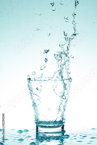 water splash in glasses isolated on white