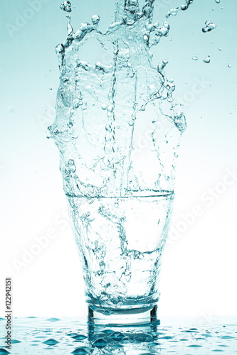 water splash in glasses isolated on white