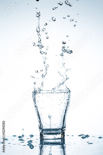 water splash in glasses isolated on white