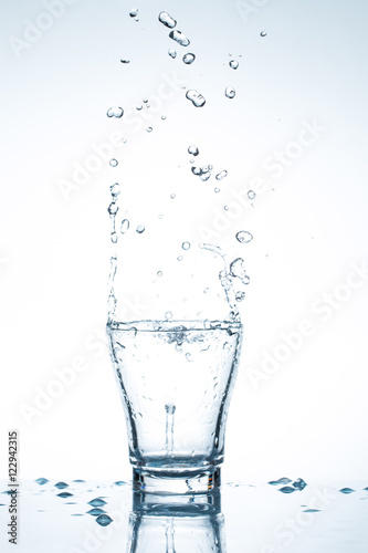 water splash in glasses isolated on white
