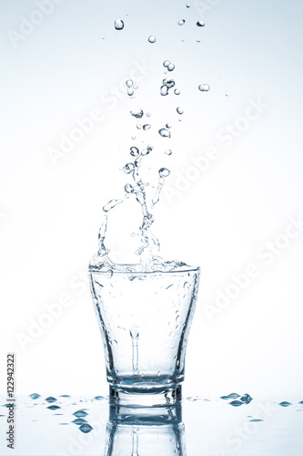 water splash in glasses isolated on white