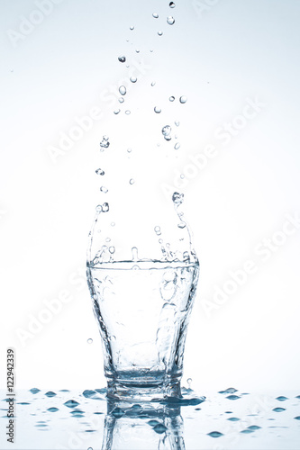 water splash in glasses isolated on white