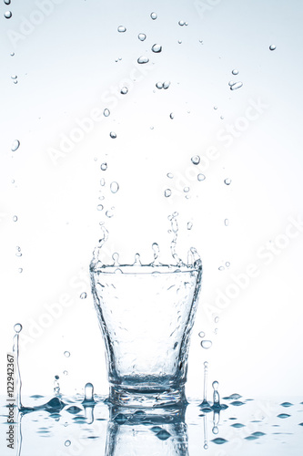 water splash in glasses isolated on white