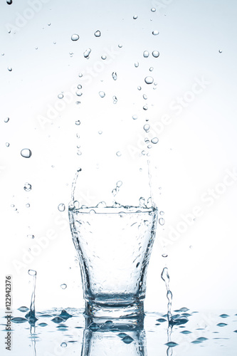 water splash in glasses isolated on white