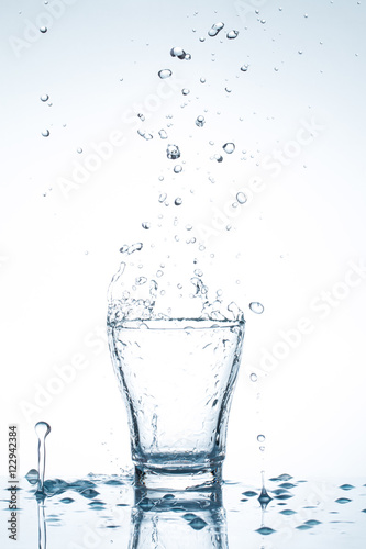 water splash in glasses isolated on white