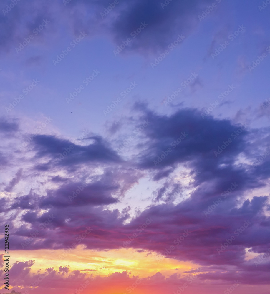 Beautiful sunset through the evening cloudy sky/Beautiful sunset through the evening cloudy sky