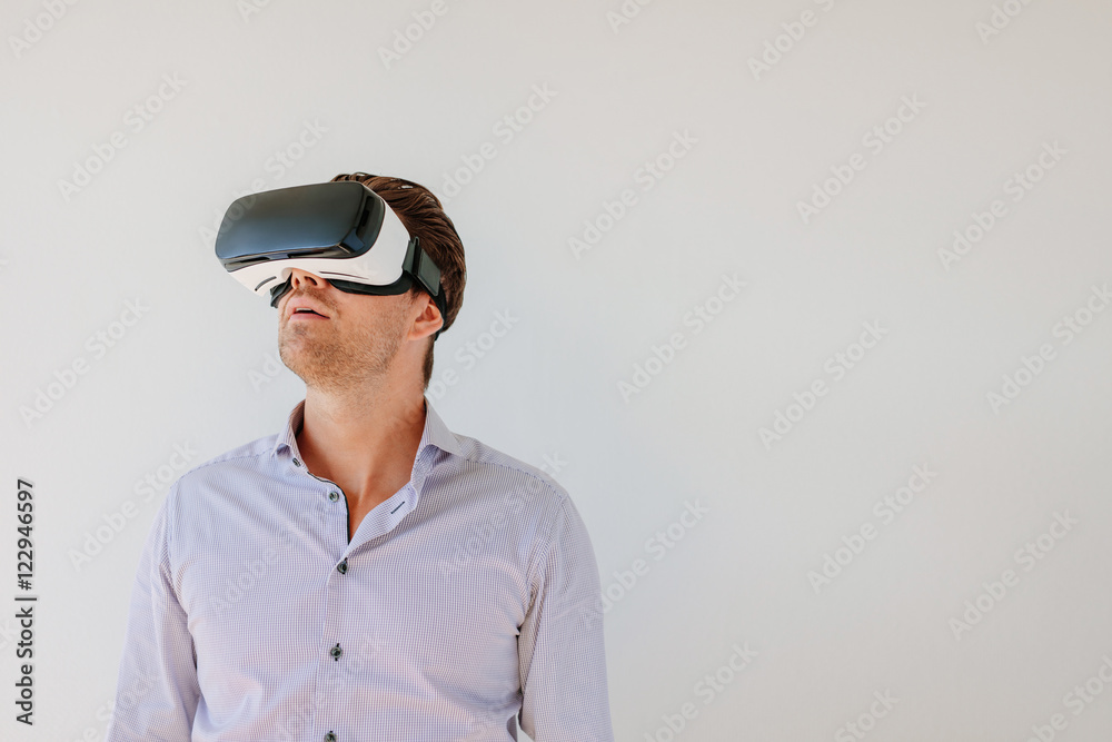 Man with VR headset looking away at the objects Man with VR headset looking away at the objects