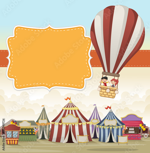 Cartoon kids inside a hot air balloon flying over cartoon circus. Vintage carnival background. 