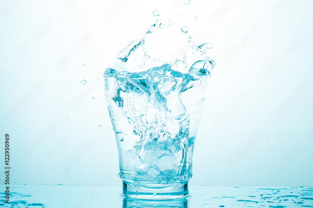 water splash in glasses isolated on white water splash in glasses isolated on white