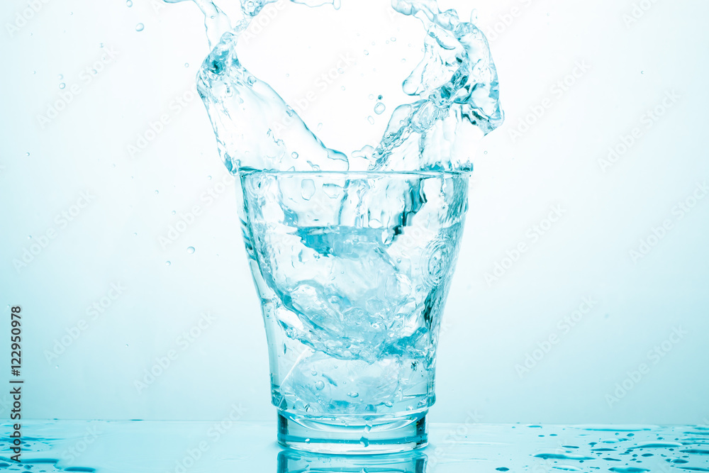 water splash in glasses isolated on white water splash in glasses isolated on white