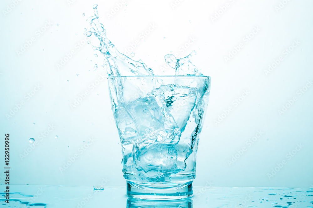 water splash in glasses isolated on white