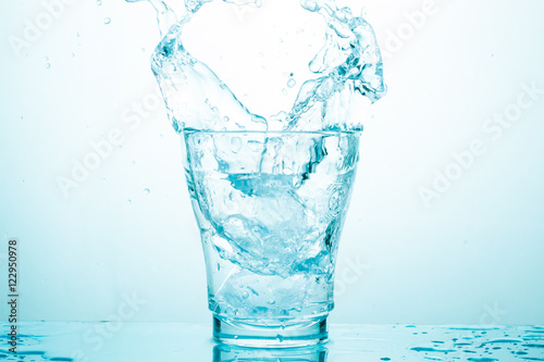 water splash in glasses isolated on white