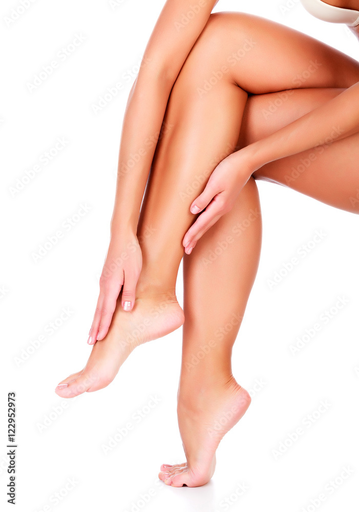Female legs and hands, white background, isolated Female legs and hands, white background, isolated