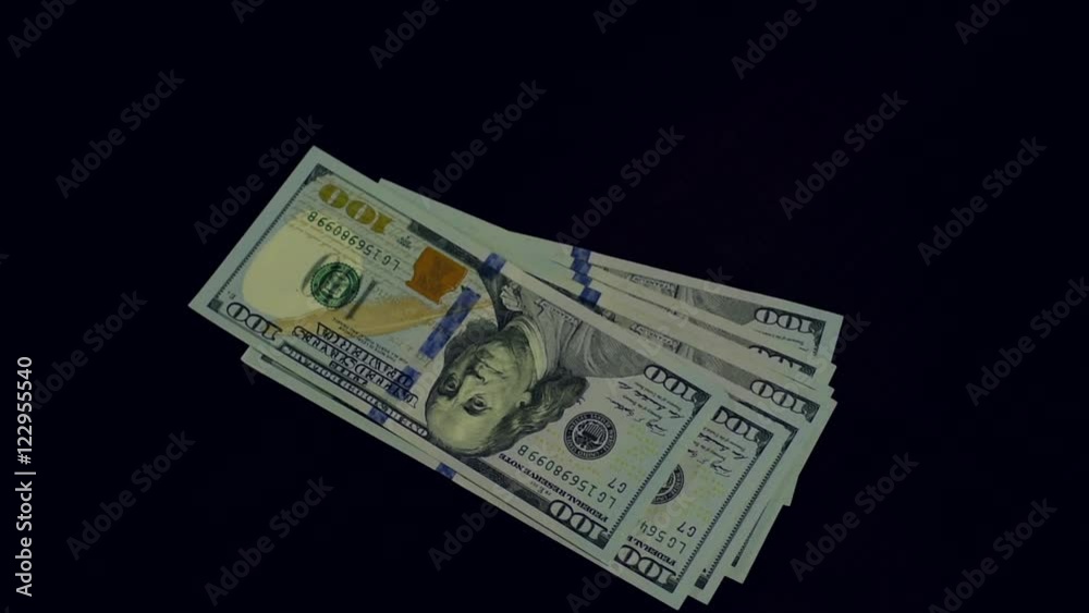 Stacks of one hundred dollar bills falling down. Stacks of one hundred dollar bills falling down.