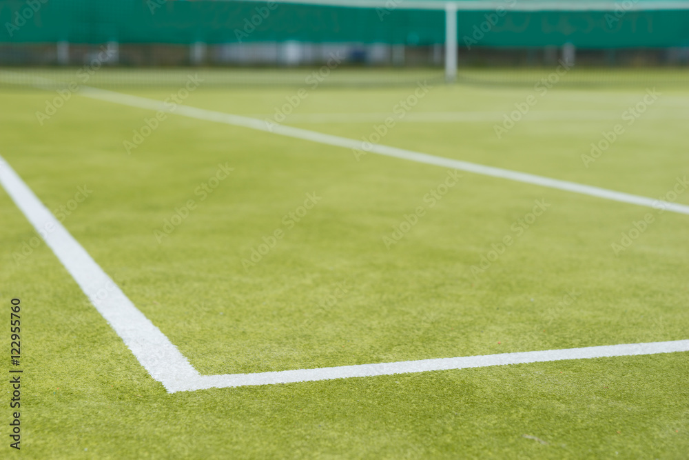 Sports field with markings and netting used in tennis Sports field with markings and netting used in tennis