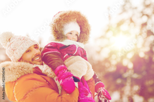 happy family in winter clothes outdoors