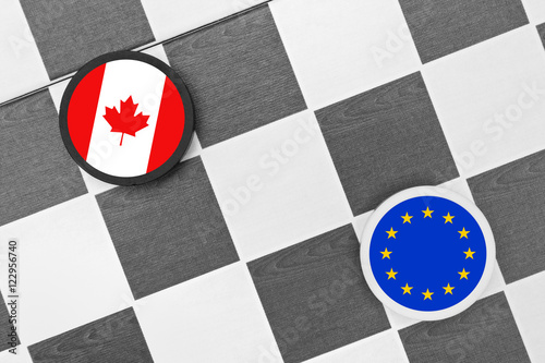 Draughts (Checkers) - Canada vs European Union - conflict between Canadian state and EU because of Economic and Trade Agreement ( CETA ). Negotiation and disagreement photo