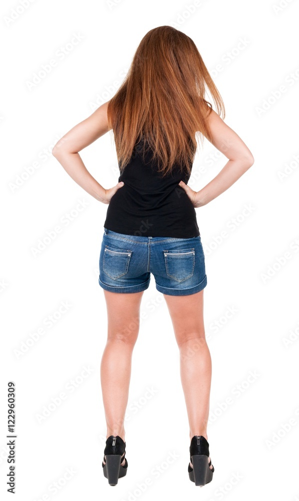 back view of standing young beautiful redhead woman. back view of standing young beautiful redhead woman.