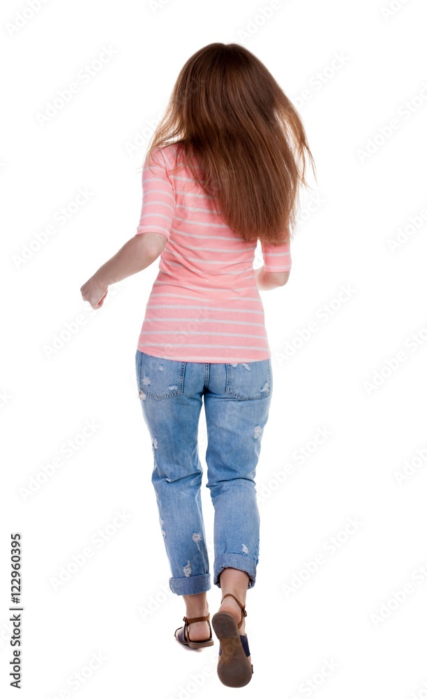 back view of running woman. beautiful redhead girl in motion. back view of running woman. beautiful redhead girl in motion.