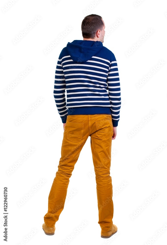 Back view of handsome man in striped hooded sweater. Standing young guy in jeans. Rear view people collection. backside view of person. Isolated over white background. Back view of handsome man in striped hooded sweater. Standing young guy in jeans. Rear view people collection. backside view of person. Isolated over white background.