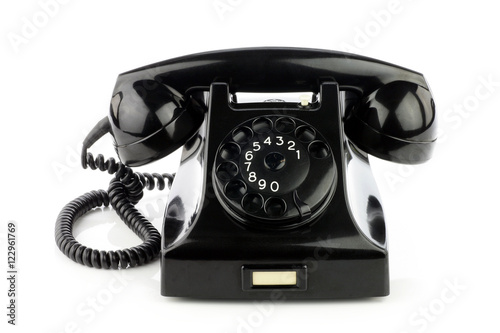 Old retro bakelite telephone. On a white background. photo