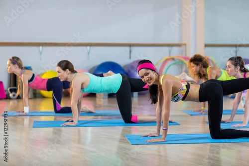 Group of women performing stretching exercise