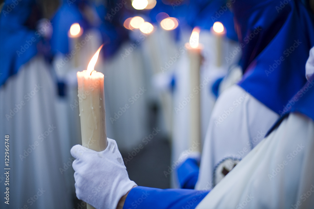 Fototapeta premium Penitents bearing candles, Holy Week 2008, Seville, Spain