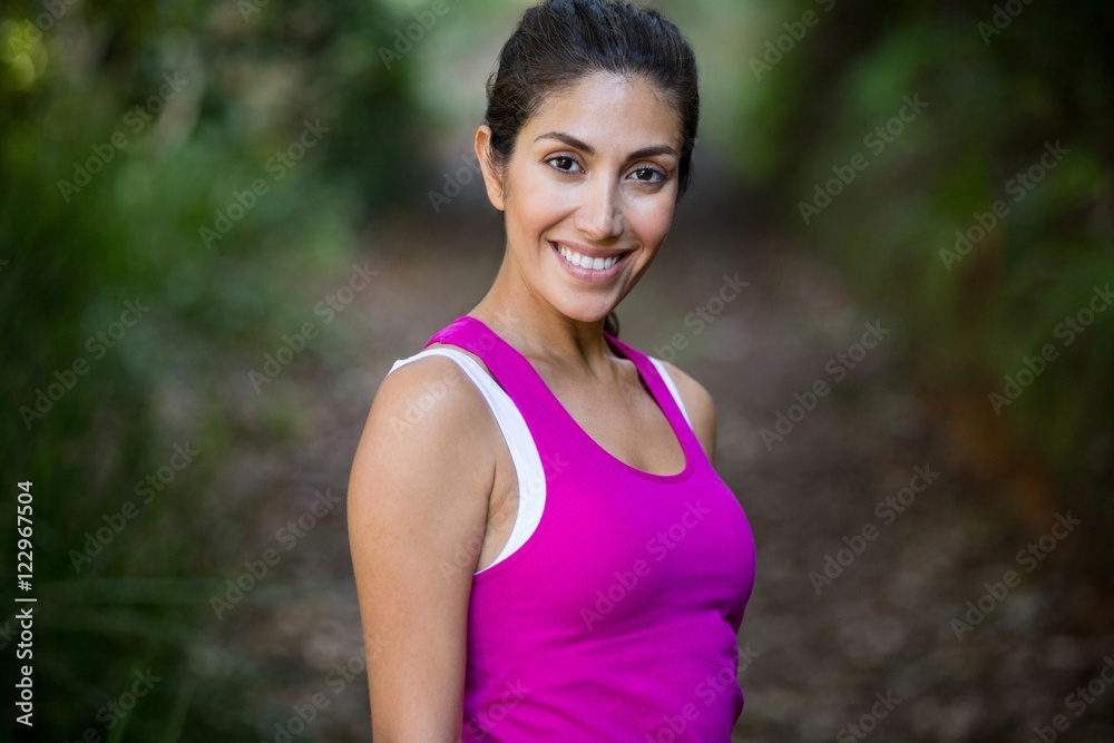 Woman jogging through a forest Woman jogging through a forest