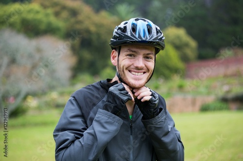 Male athletic wearing bicycle helmet