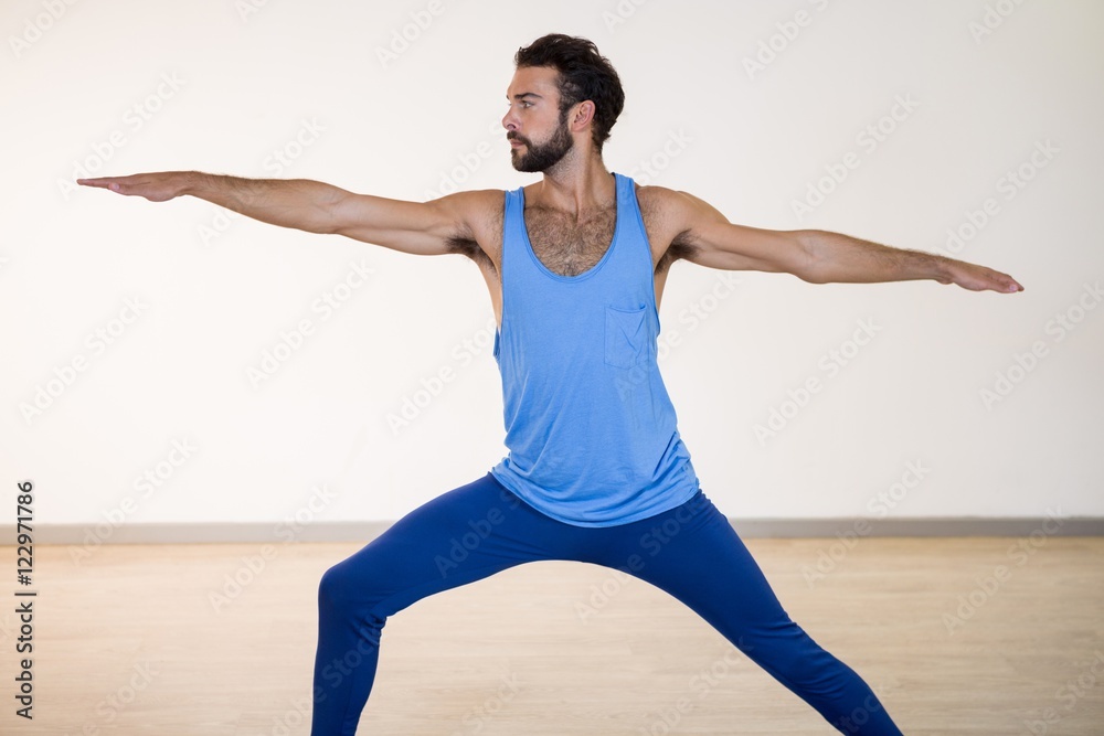 Fototapeta premium Man performing warrior pose 