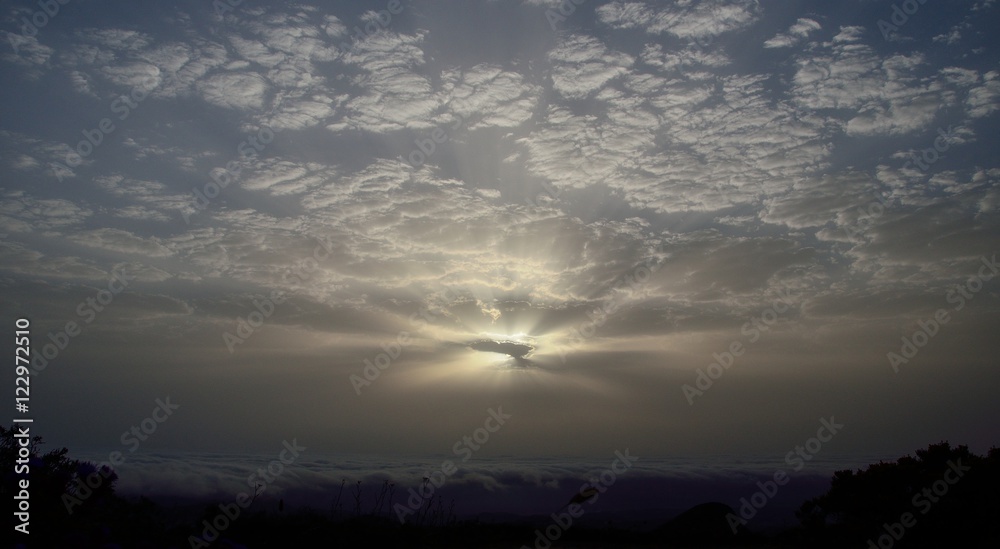 Amazing dawn with sunrays through the clouds Amazing dawn with sunrays through the clouds
