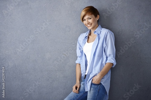 Happy young woman in casual clothes photo