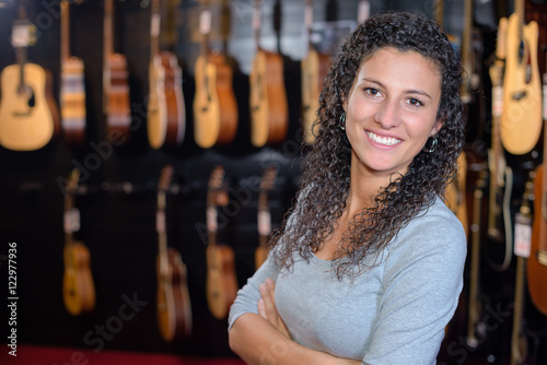Portrait of woman in guitar shop