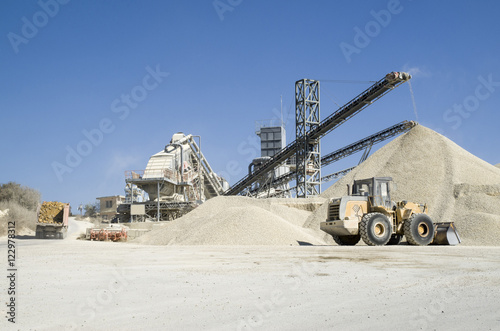 Working belt conveyors and a piles of rubble in Gravel Quarry