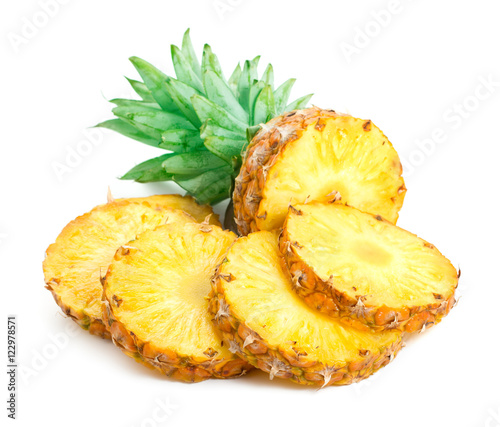 pineapple slices with fresh green leaves isolated on white background