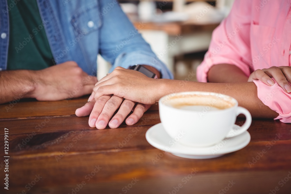 Mid-section of couple holding hands Mid-section of couple holding hands