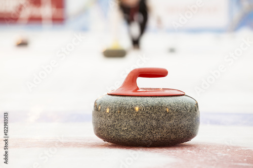 Canvas Print Curling stones on ice