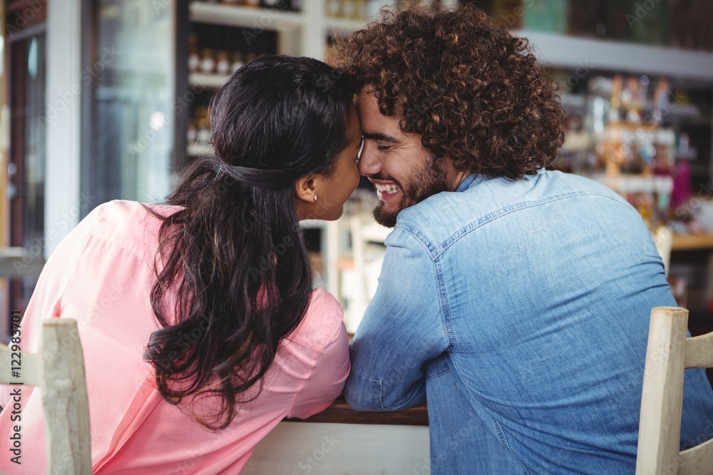 Couple romancing in cafeteria Couple romancing in cafeteria